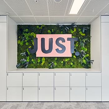 Image of 3 business people talking on London office building veranda